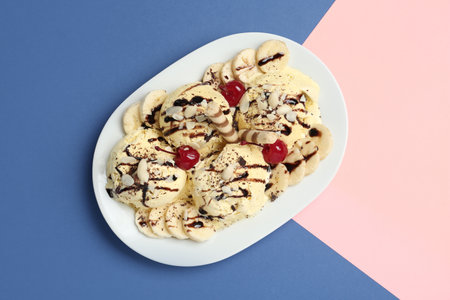Yummy dessert with banana ice cream on color background, top viewの写真素材