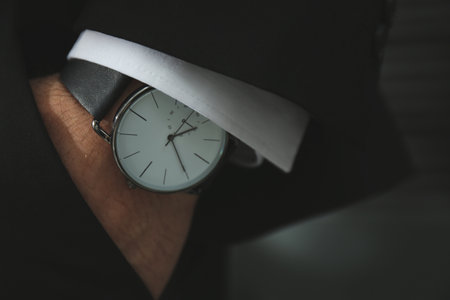 Businessman in suit with luxury wrist watch, closeupの写真素材