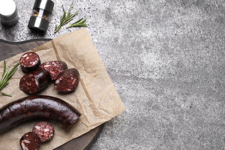 Tasty blood sausages with rosemary, flat lay. Space for textの写真素材