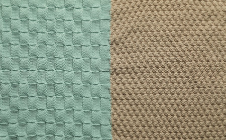 Different textured woolen fabric as background, top view