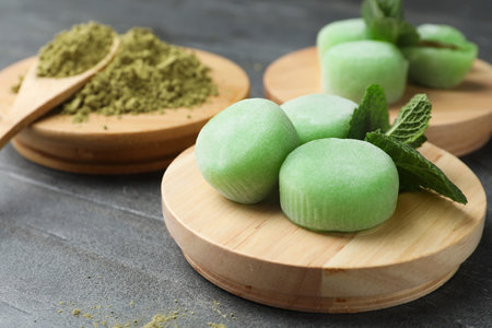 Delicious matcha mochi on gray table, space for textの写真素材