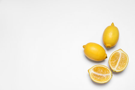 Many fresh ripe lemons on white background, top viewの写真素材