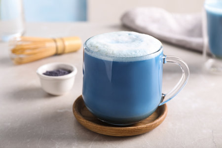Delicious blue matcha drink on light gray tableの写真素材