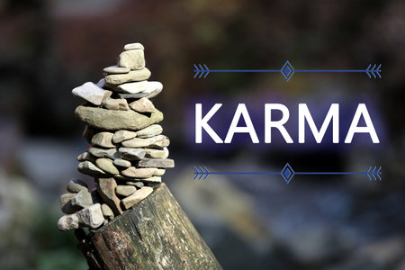Karma concept. Balancing stones on tree stump in forestの写真素材