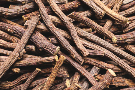 Dried sticks of liquorice root as background, top viewの写真素材
