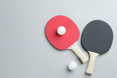 tennis racket rackets and balls on gray background, flat lay. Space for textの写真素材