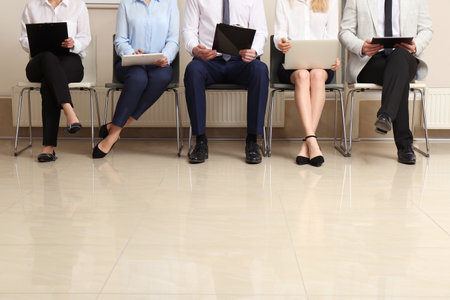 People waiting for job interview in office hall, closeupの写真素材