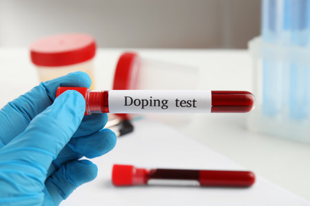 Doctor holding test tube with blood sample, closeup. doping controlの写真素材