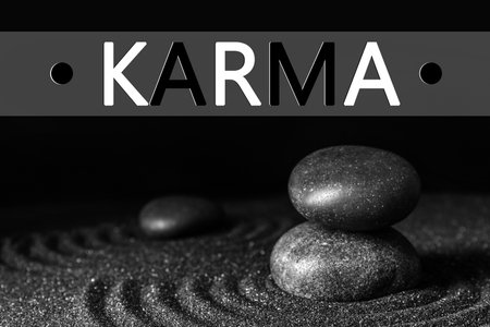 Karma concept. Black sand and stones against dark backgroundの写真素材
