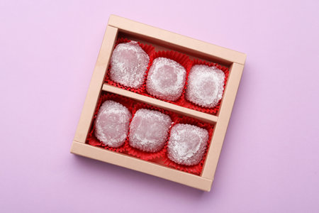 Box of delicious mochi on light background, top view. Traditional Japanese dessertの写真素材