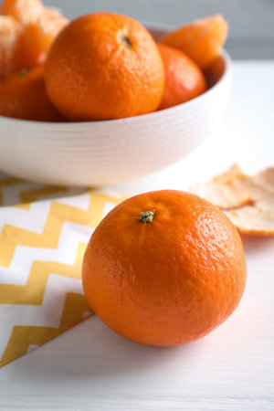Delicious fresh ripe tangerine on white tableの写真素材