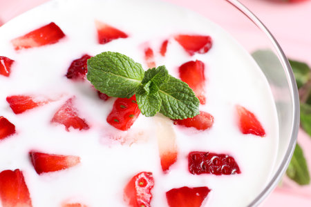 Yummy drink with strawberries in glass, closeupの写真素材