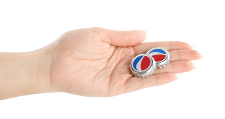 MYKOLAIV, UKRAINE - FEBRUARY 12, 2021: Woman holding Pepsi lids on white background, closeupのeditorial素材
