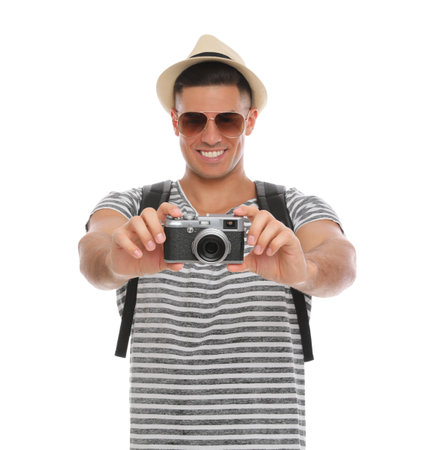 Man with straw hat taking picture on white background. summer travelの写真素材