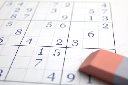 Sudoku puzzle grid and eraser, closeup viewの写真素材