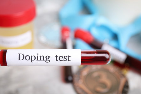 Tube of blood with words Doping test on blurred background, closeupの写真素材