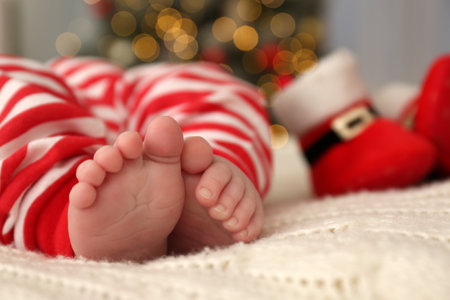 Cute little baby on blanket in room decorated for Christmas, closeupの写真素材