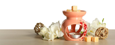 Composition with aroma lamp on wooden table against light gray background, space for textの写真素材