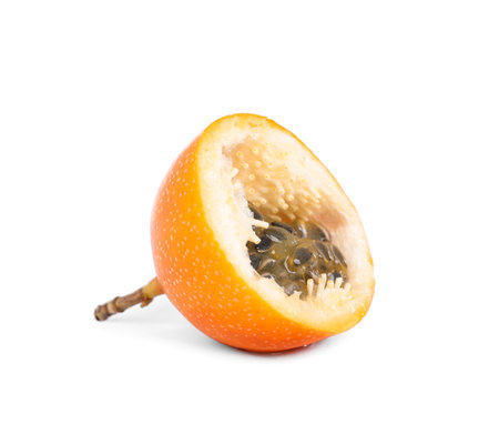 Half of delicious yellow passion fruit isolated on whiteの写真素材