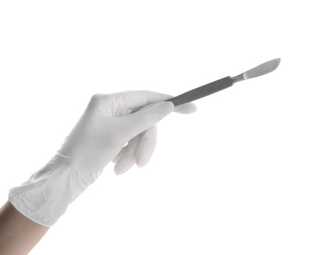 Doctor holding surgical scalpel on white background, closeup. medical instrumentsの写真素材