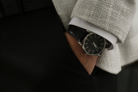Businessman in suit with luxury wrist watch, closeupの写真素材