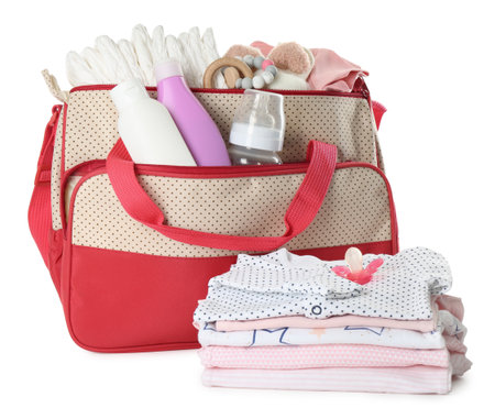 Mother's bag with baby's stuff isolated on whiteの写真素材