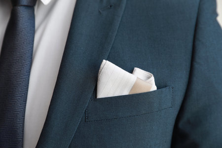Man with handkerchief in suit pocket, closeup viewの写真素材