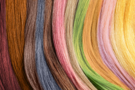 Strands of different color hair as background, closeupの写真素材