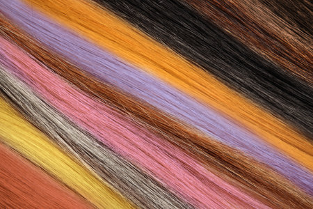 Strands of different color hair as background, closeupの写真素材