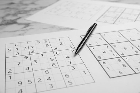 Sudoku and pen on table, closeup viewの写真素材