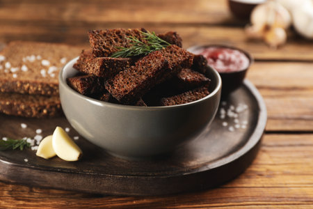 Delicious hard chucks in bowl on wooden tableの写真素材