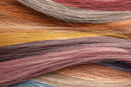 Strands of different color hair as background, closeupの写真素材