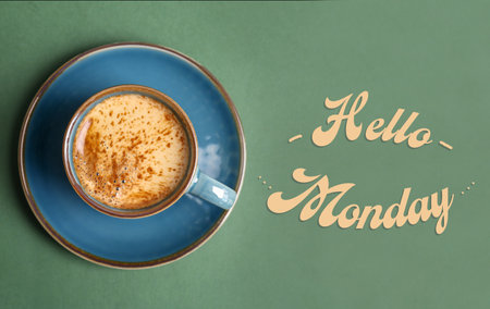 Cup of hot aromatic coffee and phrase Hello Monday on color background, top viewの写真素材