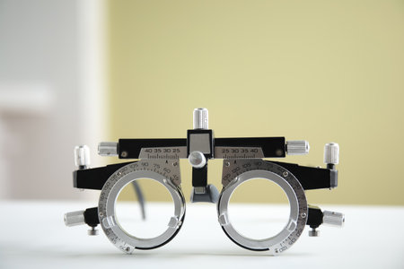 Trial frame on white table. Ophthalmologist tool