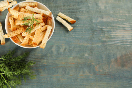 Delicious hard chucks on light blue wooden table, flat lay. Space for textの写真素材