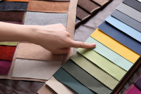 Woman choosing among colorful leather samples, closeupの写真素材