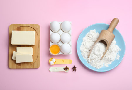 Cooking utensils and ingredients on pink background, flat layの写真素材