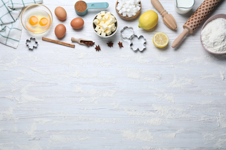 Cooking utensils and ingredients on white wooden table, flat lay. Space for textの写真素材