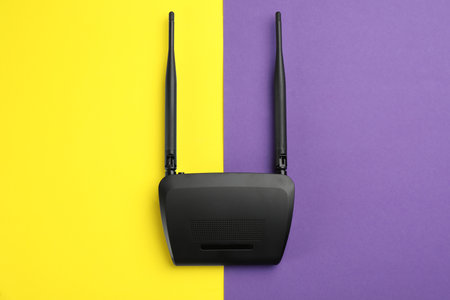 Modern WiFi router on color background, top viewの写真素材