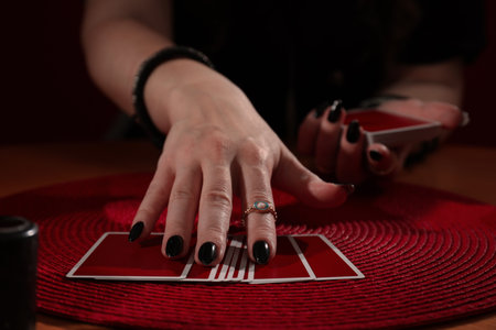 Soothsayer predicting future with cards at table indoors, closeupの写真素材