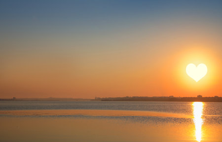 picturesque view of beautiful sunset on riversideの写真素材