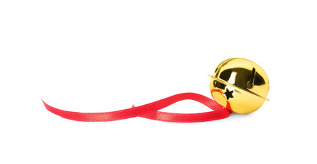 Shiny golden sleigh bell with ribbon isolated on whiteの写真素材