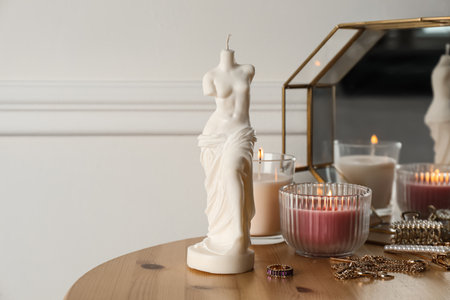 Beautiful Venus De Milo candle on wooden table. Stylish decorの写真素材