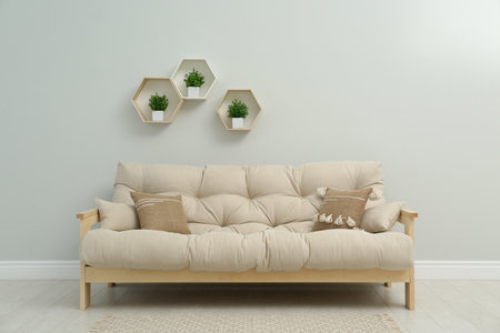 Stylish beige sofa in living room interiorの写真素材