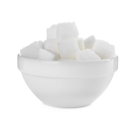 Sugar cubes in bowl on white backgroundの写真素材