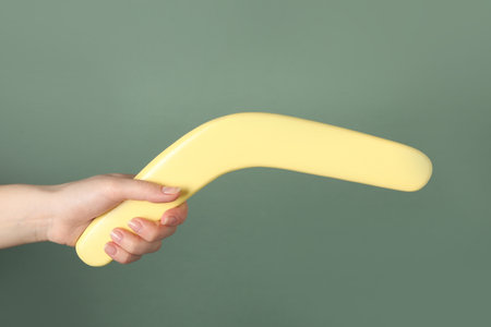Woman holding boomerang on gray background, closeupの写真素材