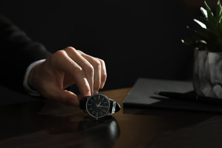 Man luxury wrist watch on table, putting closeup. Space for textの写真素材