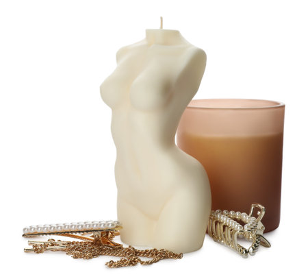Beautiful female body shape candle and accessories on white backgroundの写真素材