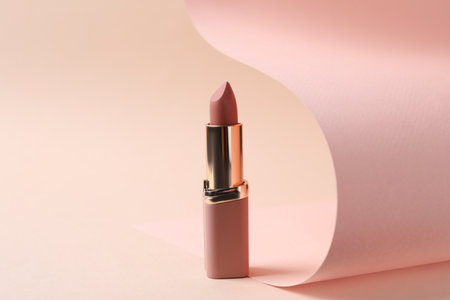 Beautiful lipstick on beige background. professional makeup productの写真素材