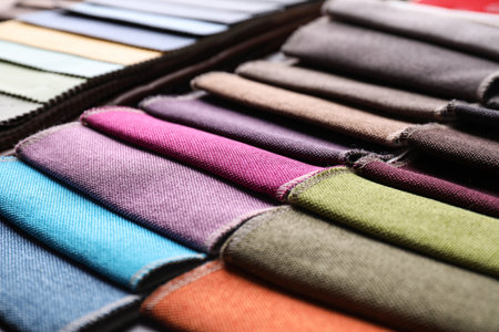 Many different colorful fabric samples as background, closeupの写真素材